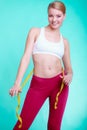 Diet. Fitness woman fit girl with measure tape measuring her waist Royalty Free Stock Photo