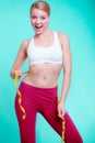 Diet. Fitness woman fit girl with measure tape measuring her waist Royalty Free Stock Photo