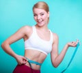 Diet. Fitness woman fit girl with measure tape measuring her waist Royalty Free Stock Photo