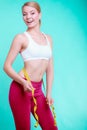 Diet. Fitness woman fit girl with measure tape measuring her waist Royalty Free Stock Photo