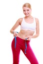 Diet. Fitness woman fit girl with measure tape measuring her waist Royalty Free Stock Photo