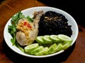 A plate of chicken rice with brown rice and vegetables Royalty Free Stock Photo