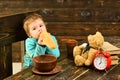 Diet and food. Diet, little boy eat french baguette at table. Diet cures more than doctors. Healthy diet for child