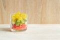 Diet Fresh tasty mix fruit salad in a glass jar on wooden table. Chopped juicy oranges, kiwi and grapefruits Royalty Free Stock Photo