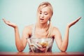 Diet. Girl with colorful measuring tapes in bowl