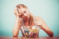 Diet. Girl with colorful measuring tapes in bowl