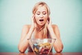 Diet. Girl with colorful measuring tapes in bowl