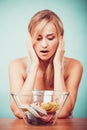 Diet. Girl with colorful measuring tapes in bowl