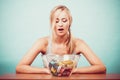 Diet. Girl with colorful measuring tapes in bowl