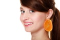 Diet. Girl with earrings of orange fruit isolated Royalty Free Stock Photo