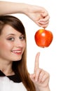 Diet. Girl offering apple seasonal fruit. Royalty Free Stock Photo