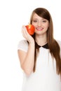 Diet. Girl offering apple seasonal fruit.