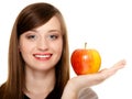 Diet. Girl offering apple seasonal fruit. Royalty Free Stock Photo