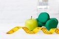 Diet Health food and lifestyle health concept. Sport exercise equipment workout with green apple Royalty Free Stock Photo