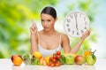 Woman with food and clock showing six Royalty Free Stock Photo