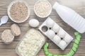 Diet, healthy food. Bottle of yogurt, crispy round bread, buckwheat noodles, oatmeal, cottage cheese, egg tray on a wooden table. Royalty Free Stock Photo