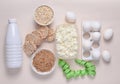 Diet, healthy food. Bottle of yogurt, crispy round bread, buckwheat noodles, oatmeal, cottage cheese, egg tray, ruler on a white Royalty Free Stock Photo