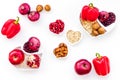 Diet for healthy heart. Food with antioxidants. Vegetables, fruits, nuts in heart shaped bowl on white background top Royalty Free Stock Photo