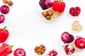 Diet for healthy heart. Food with antioxidants. Vegetables, fruits, nuts in heart shaped bowl on white background top Royalty Free Stock Photo