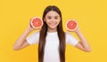 diet and kid skin beauty. positive teen girl with grapefruit. vitamin and dieting.