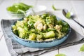 Diet lunch: salad with broccoli, chicken and vegetables on a beautiful plate on a white table. Royalty Free Stock Photo