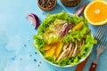 Diet menu. Healthy salad close-up, salad with chicken, egg pancakes, orange, green salad and dressing vinaigrette. Royalty Free Stock Photo