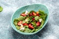 Diet menu. Healthy salad of fresh strawberry, spinach leaves, nuts and feta cheese, balsamic vinegar. Vegan food. top view Royalty Free Stock Photo