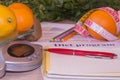 The concept of dieting, losing excess weight. Fruits, Libra, calculator and centimeter on a wooden table Royalty Free Stock Photo