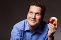 Diet nutrition. Happy man eating apple fruit Royalty Free Stock Photo