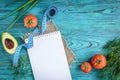 Diet plan empty notebook, menu or program of nutrition. Fresh vegetables on blue wooden background. Royalty Free Stock Photo