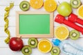 Diet plan, menu or program, tape measure, water, dumbbells and diet food of fresh fruits on white background, detox concept