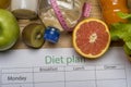 Diet plan, tape measure, water, diet of fresh fruits on the wooden floor Royalty Free Stock Photo