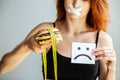 Diet. Portrait woman wants to eat a Burger but stuck skochem mouth, the concept of diet, junk food, willpower in Royalty Free Stock Photo