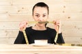 Diet. Portrait woman wants to eat a Burger but stuck skochem mouth, the concept of diet, junk food, willpower in nutrition Royalty Free Stock Photo