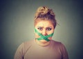Diet restriction stress. Frustrated woman with measuring tape around her mouth