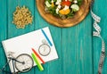 bicycle model, salad of fresh vegetables, red notepad, stopwatch Royalty Free Stock Photo