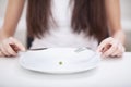 Diet. Suffering from anorexia. Cropped image of girl trying to p Royalty Free Stock Photo