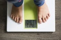 Diet time message on weight scale, overweight child concept