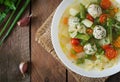 Diet vegetable soup with chicken meatballs and fresh herbs. Top view Royalty Free Stock Photo