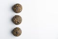 Diet vegetarian energy balls with nuts, dried fruit, oats, cocoa, peanut butter and honey, topped with chia seeds. Royalty Free Stock Photo