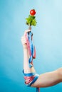 Woman hand with vegetarian food and measuring tapes. Royalty Free Stock Photo