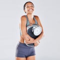 Diet, weightloss and scale with a black woman athlete in studio on a gray background for body positivity or health Royalty Free Stock Photo