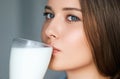 Diet and wellness, young woman drinking milk or protein shake cocktail Royalty Free Stock Photo