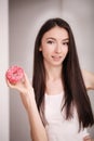 Diet. Woman Measuring Body Weight On Weighing Scale Holding Donut and apple. Sweets Are Unhealthy Junk Food. Dieting, Healthy Eat Royalty Free Stock Photo