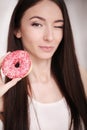 Diet. Woman Measuring Body Weight On Weighing Scale Holding Donut and apple. Sweets Are Unhealthy Junk Food. Dieting, Healthy Eat Royalty Free Stock Photo