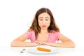 Diet woman with one carrot for dinner Royalty Free Stock Photo