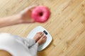 Diet. Woman On Weighing Scale, Holding Donut. Unhealthy Food. Ob Royalty Free Stock Photo