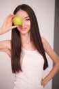 Diet. Woman Measuring Body Weight On Weighing Scale Holding Donut and apple. Sweets Are Unhealthy Junk Food. Dieting, Healthy Eat Royalty Free Stock Photo