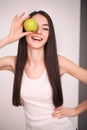 Diet. The young beautiful girl who cares for her figure, making healthy food choices, fresh fruit. The concept of healthy eating Royalty Free Stock Photo