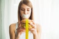 Diet. Young woman with duct tape over her mouth, preventing her to eat junk food. Healthy eating concept. Royalty Free Stock Photo